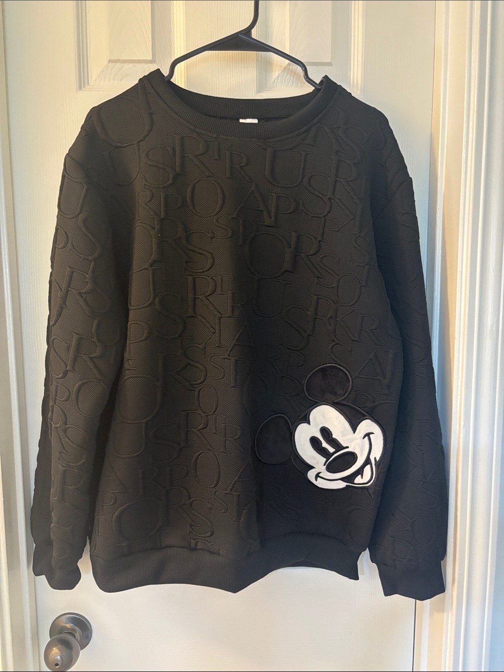 Black Crewneck Sweater with Embossed Pattern and Mickey Patch
